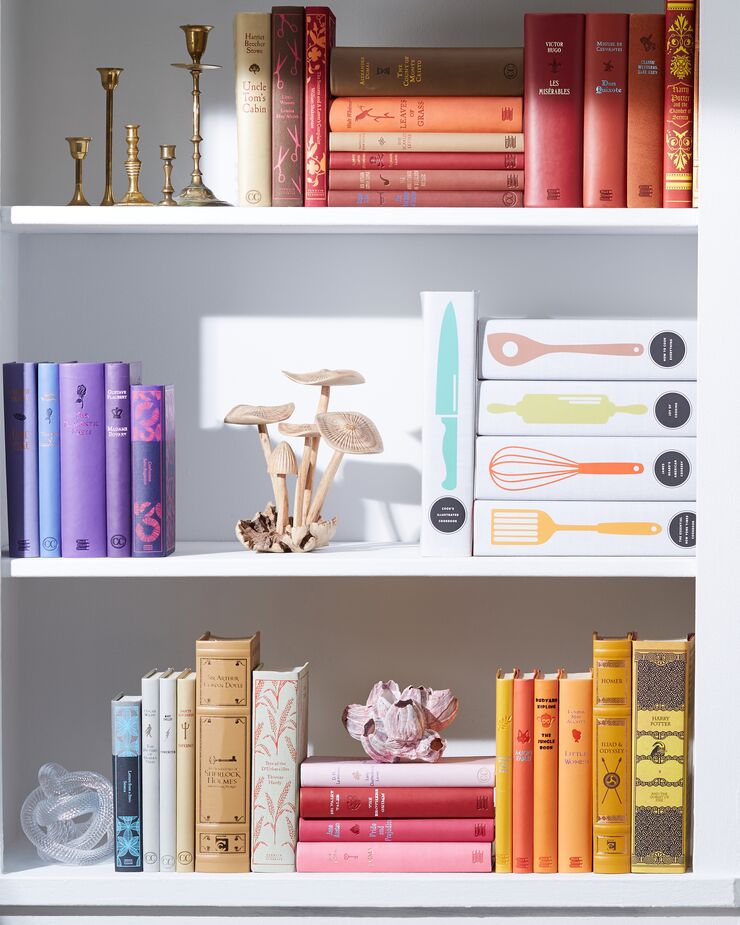 Alternating stacks of horizontal books among rows of vertical books can add visual interest—and enable you to neatly fit oversize volumes on your shelves.  
